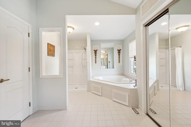 bathroom with tile patterned floors and separate shower and tub