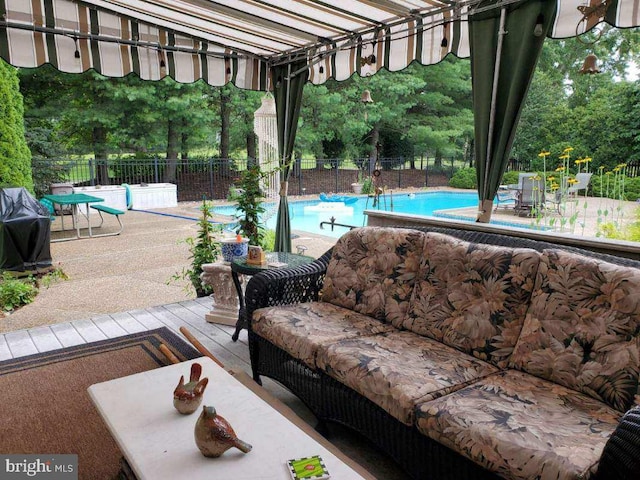 view of patio / terrace with outdoor lounge area and a community pool