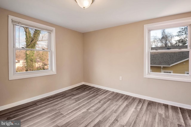 spare room featuring hardwood / wood-style flooring