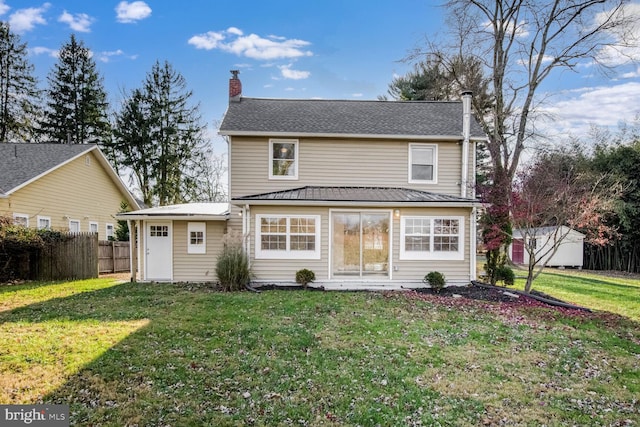 back of house with a yard