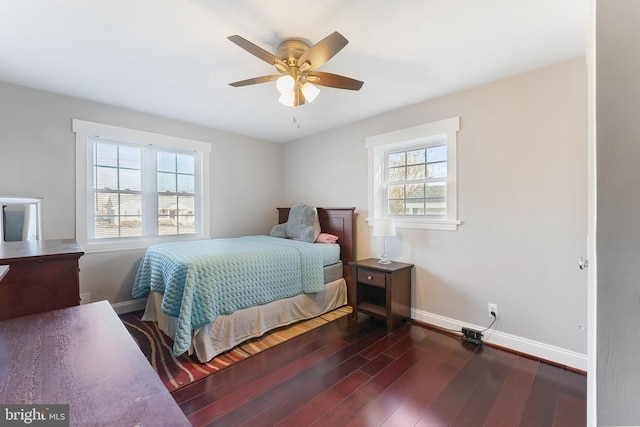 bedroom featuring ceiling fan and dark wood-type flooring