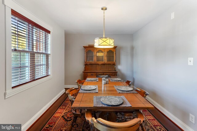 dining area with hardwood / wood-style floors