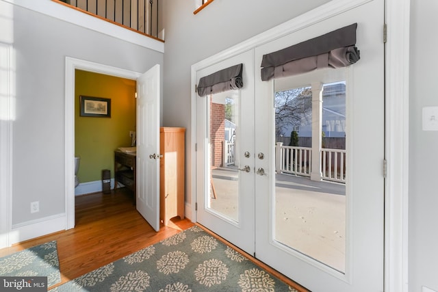 doorway to outside featuring french doors and hardwood / wood-style flooring