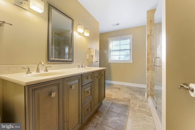 bathroom featuring vanity and an enclosed shower