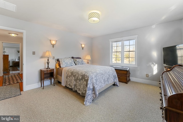 bedroom featuring light carpet