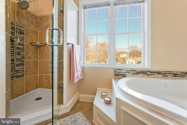 bathroom with tile patterned floors and plus walk in shower