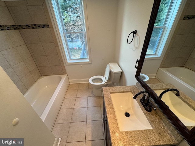 bathroom with tile patterned flooring, vanity, and toilet