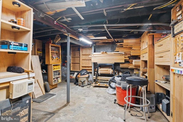 basement with a workshop area