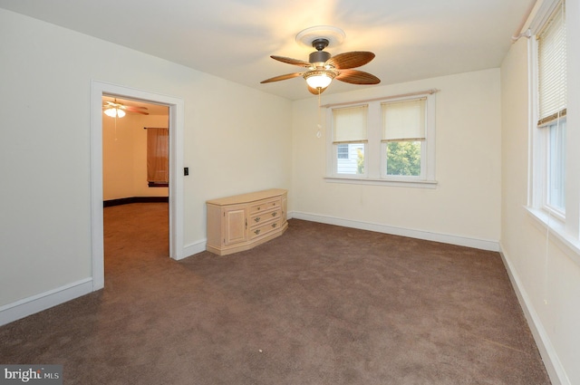 carpeted empty room with a healthy amount of sunlight