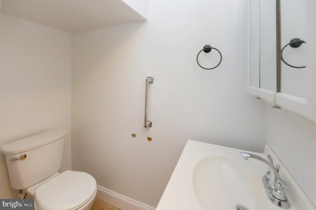 bathroom with toilet and sink