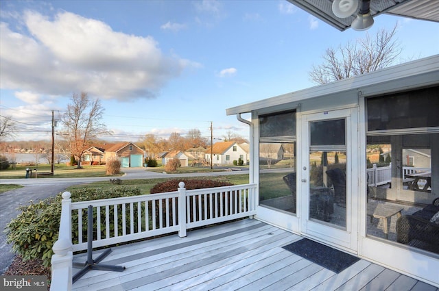 deck with a sunroom