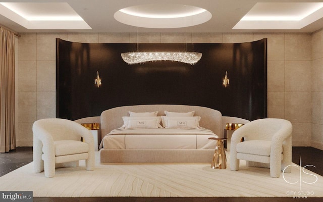 bedroom with a chandelier, a raised ceiling, and tile walls