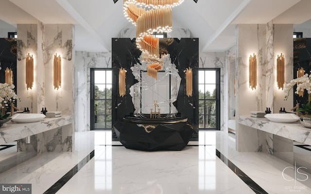 bathroom with sink, a healthy amount of sunlight, and an inviting chandelier