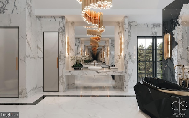 bathroom with a notable chandelier, a bathtub, vanity, and elevator