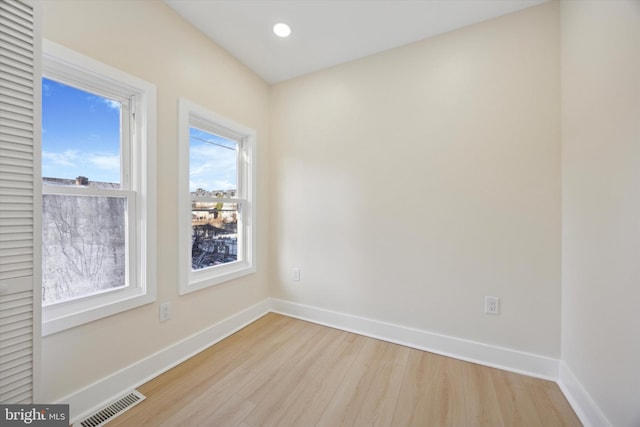 unfurnished room featuring light wood-type flooring