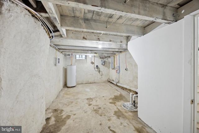 basement featuring gas water heater and electric panel