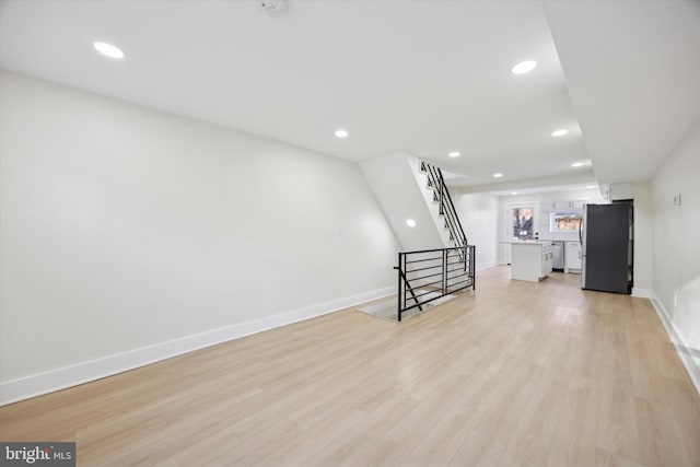 living room with light hardwood / wood-style flooring