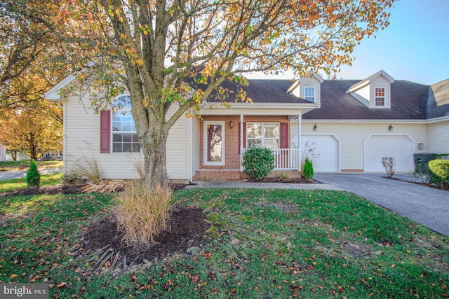 view of front of property with covered porch and a garage