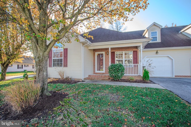 view of front of house featuring a porch and a garage