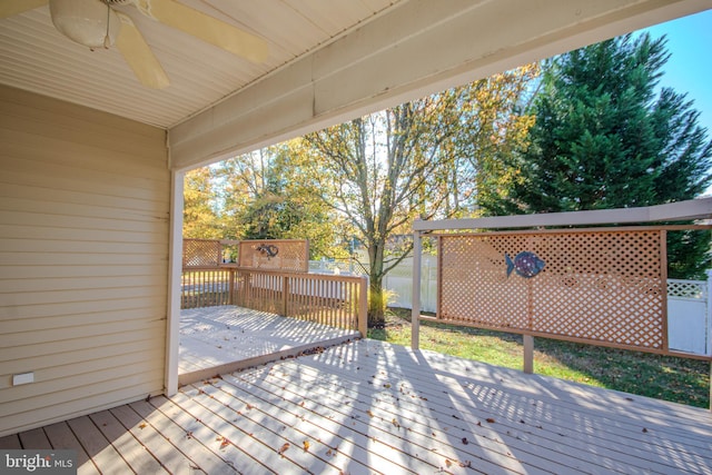 wooden terrace featuring ceiling fan