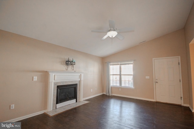 unfurnished living room featuring vaulted ceiling, ceiling fan, and dark wood-type flooring