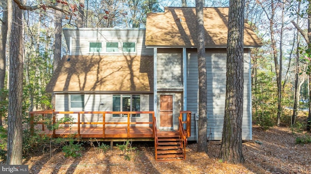 rear view of house featuring a deck