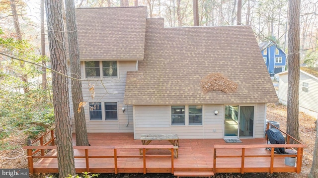 back of property featuring a deck