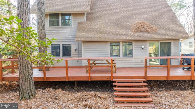 rear view of property with a deck