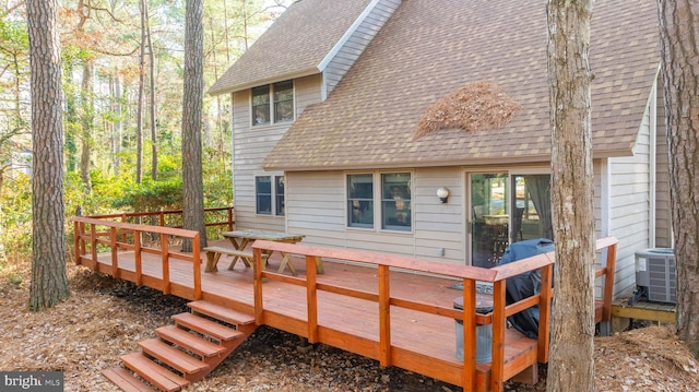 back of house featuring a wooden deck and central AC