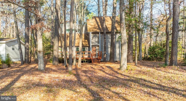 back of house featuring a deck