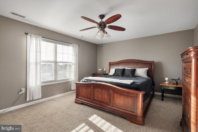 bedroom with light carpet and ceiling fan