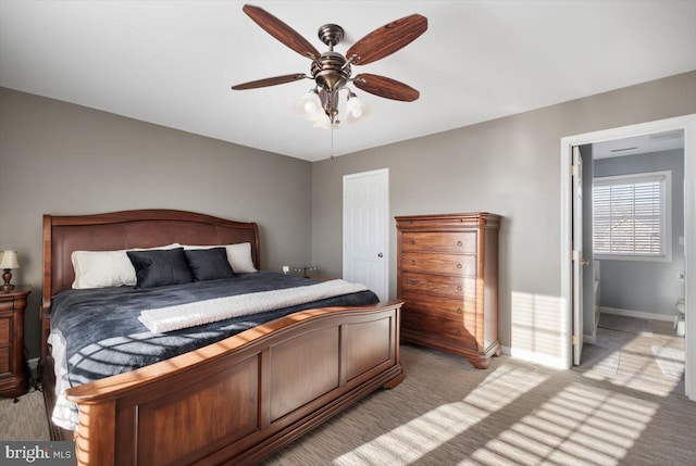 bedroom featuring ceiling fan and light carpet