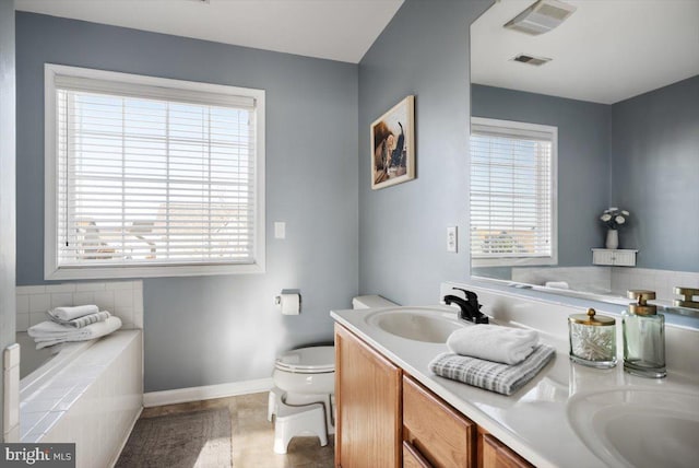 bathroom with tile patterned flooring, vanity, and toilet