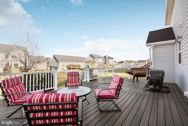 wooden terrace with a grill