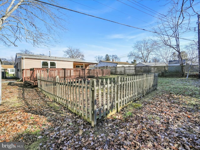 back of house with a wooden deck