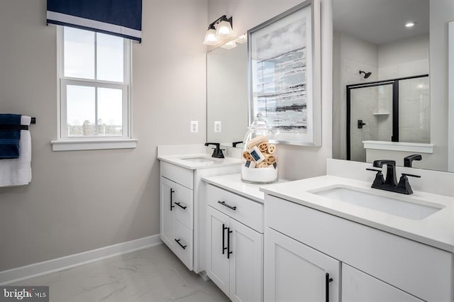 bathroom with vanity and a shower with door