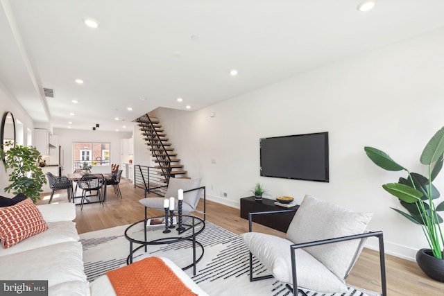 living room with light hardwood / wood-style flooring