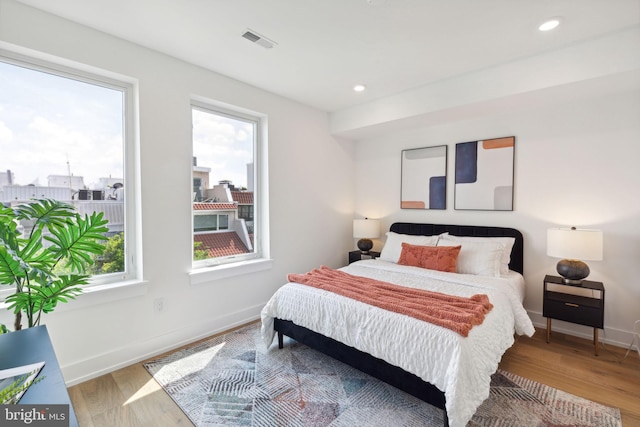 bedroom with hardwood / wood-style flooring