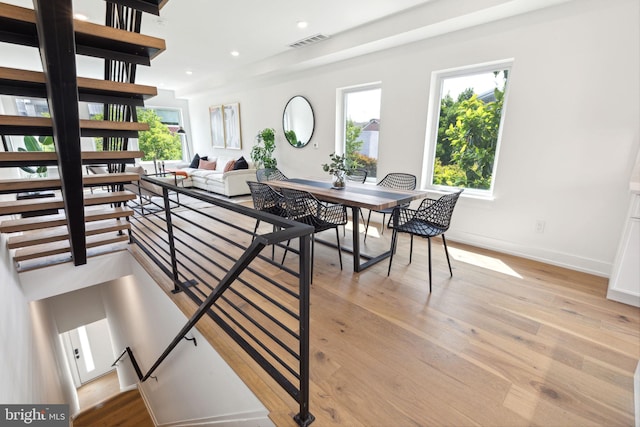 dining space with light hardwood / wood-style flooring