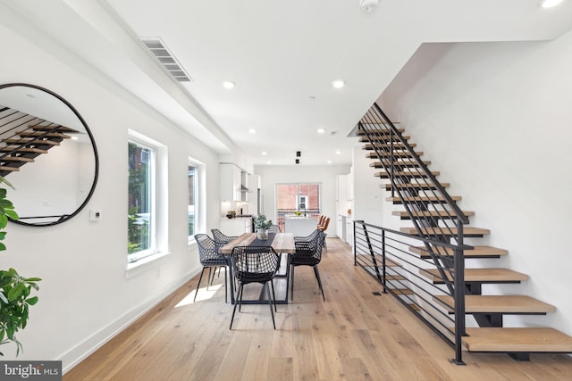 dining room featuring light hardwood / wood-style flooring