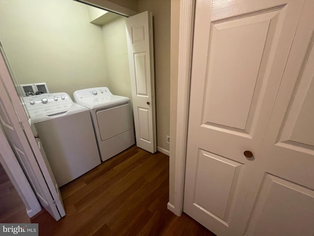 washroom with washer and dryer and dark hardwood / wood-style floors