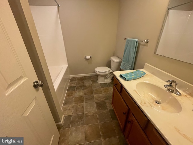 bathroom featuring tile patterned flooring, vanity, and toilet