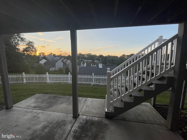 patio terrace at dusk with a yard