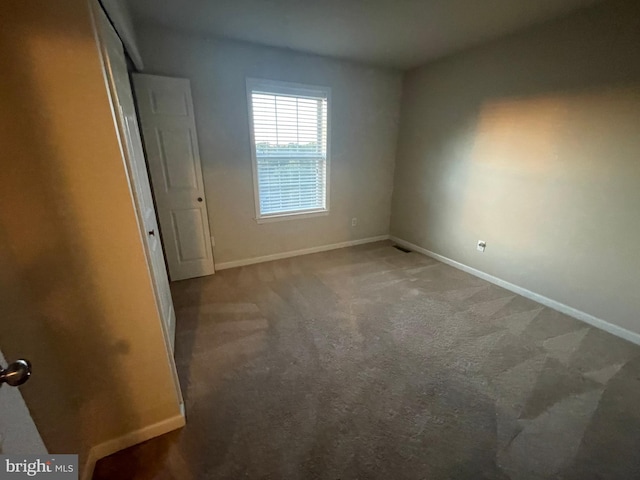 spare room featuring carpet floors