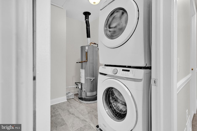 laundry area featuring stacked washer and dryer and water heater