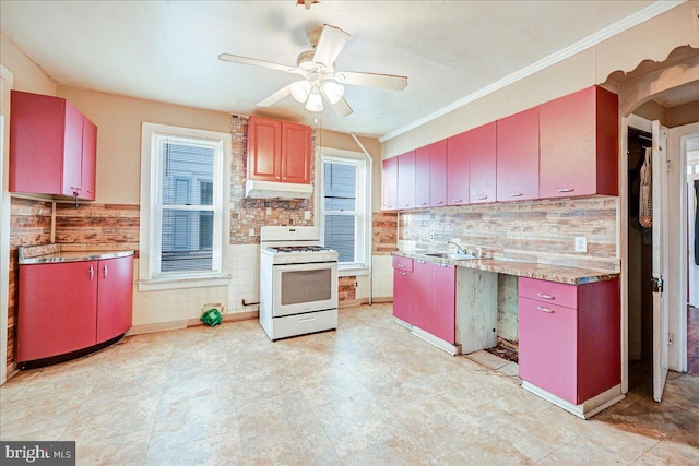 kitchen with tasteful backsplash, ornamental molding, ceiling fan, sink, and white range with gas stovetop