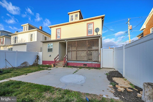 back of house with a patio area