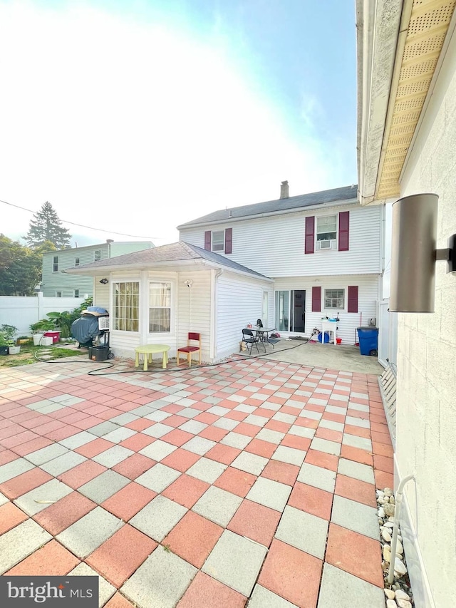 rear view of house featuring a patio