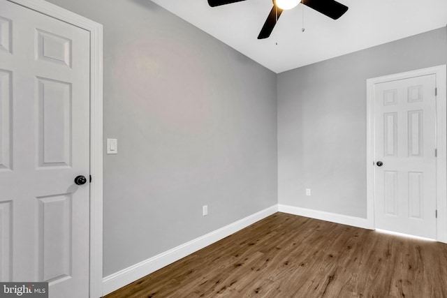 unfurnished room with hardwood / wood-style floors and ceiling fan