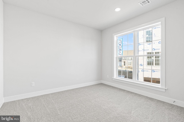 unfurnished room featuring carpet floors